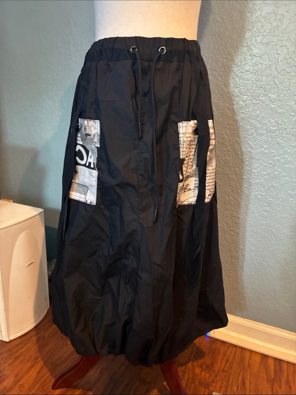 Black A-Line Drawstring Bubble Hem Skirt with Graphic Patch Pockets